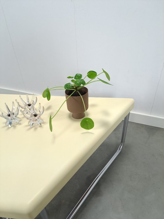 Image 1 of Space age triangular plastic table with chrome tubular frame legs