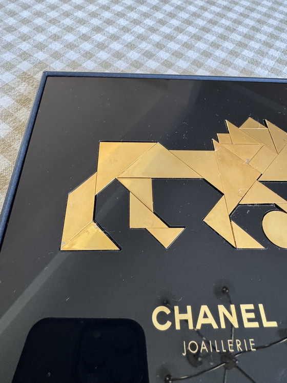 Image 1 of Raro león Chanel Tangram