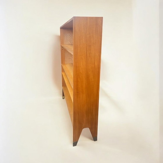Image 1 of Mid - Century tapered bookcase with brass shoes. Very high quality design piece from the 50s/60s.