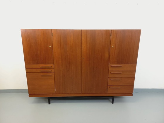 Image 1 of Tall, modernist, vintage Scandinavian sideboard in teak and black metal from the 1960s
