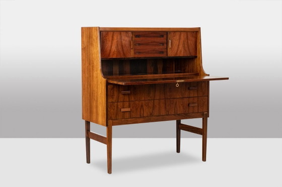 Image 1 of Commode van palissanderhout met 2 laden, die tevens als secretair dient. Jaren 70.