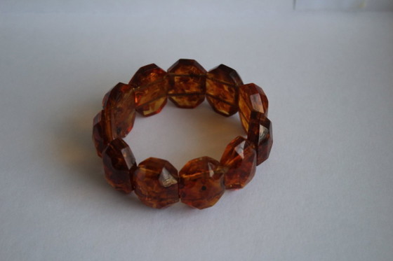 Image 1 of Amber bracelet, intricately cut, 46 grams of honey amber.