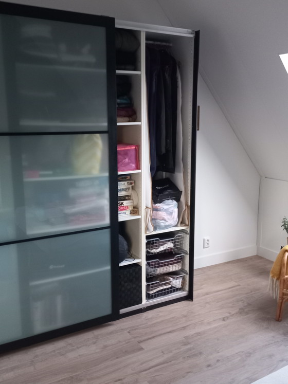 Image 1 of Black bamboo finished Pax wardrobe.