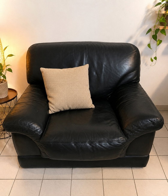 Image 1 of Large, very comfortable black leather armchair in a club style.