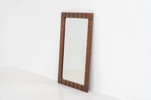Sculptural graphic wall mirror (Sweden, 1960s).