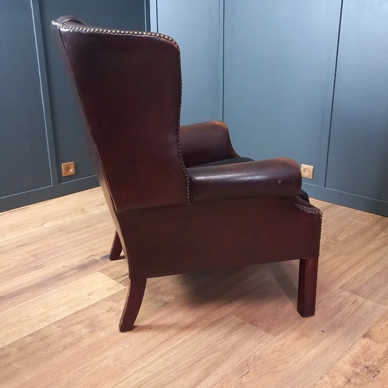 Image 1 of Steigern Sie Ihr Wohngefühl mit diesem beeindruckenden Set Chesterfield-Ohrensesseln aus Kuhfell!