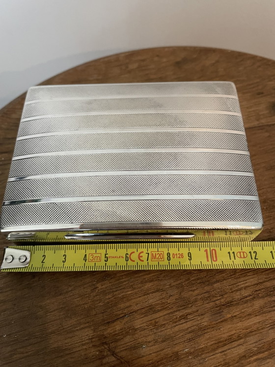 Image 1 of Estuches para cigarrillos y apagavelas, chapados en plata.