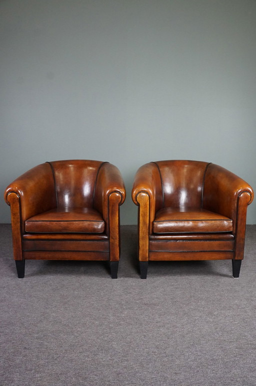 2x Vintage schapenleren clubfauteuils