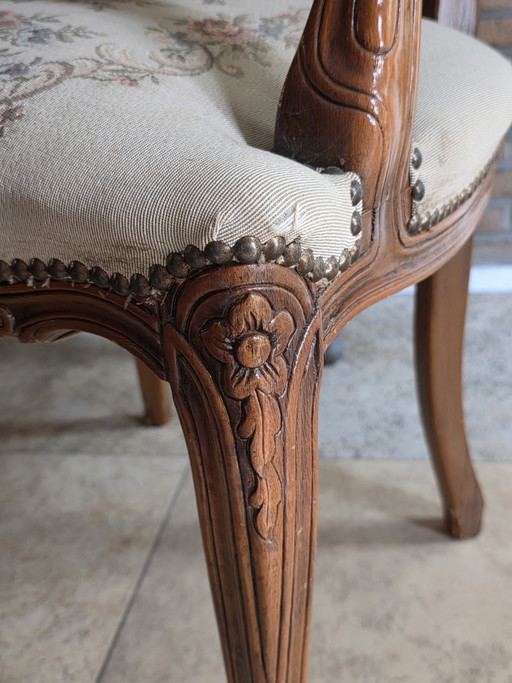 2 classic armchairs in elegant Louis XV style.