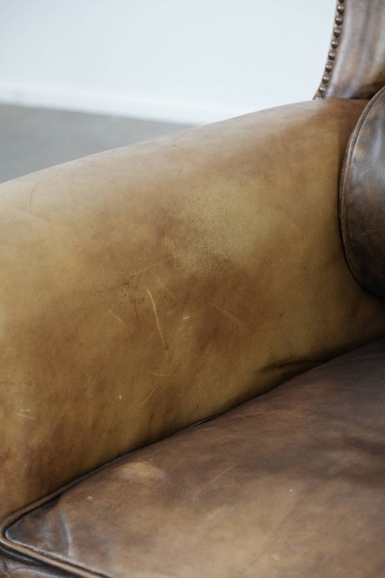 Image 1 of Ohrensessel im englischen Stil aus Kuhfell