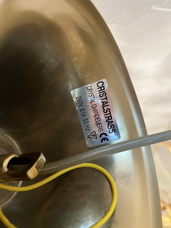 Image 1 of Lampadario con struttura in oro e 4 luci a forma di borsa di cristallo