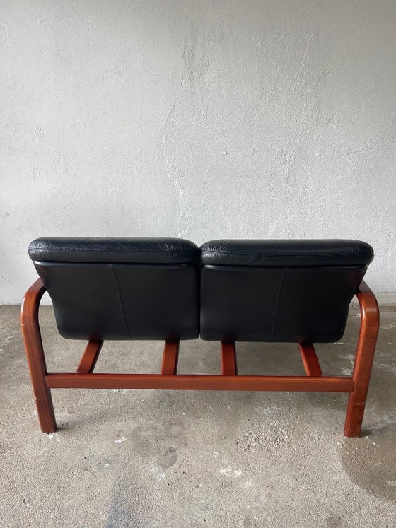 Image 1 of Vintage 2-seater lounge sofa — black leather & solid wood, Italy, 1970s–80s