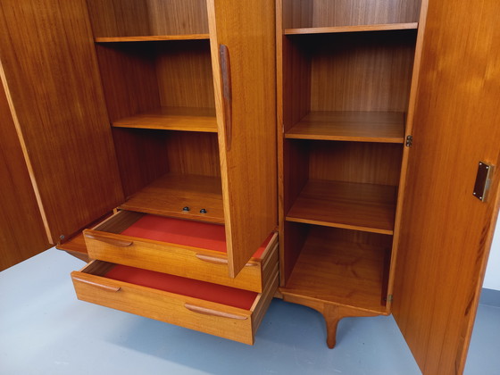 Image 1 of Scandinavische vintage kledingkast in teakhout uit de jaren 60 van ontwerpers Tricoire en Vecchione voor "Meubles TV Paris".