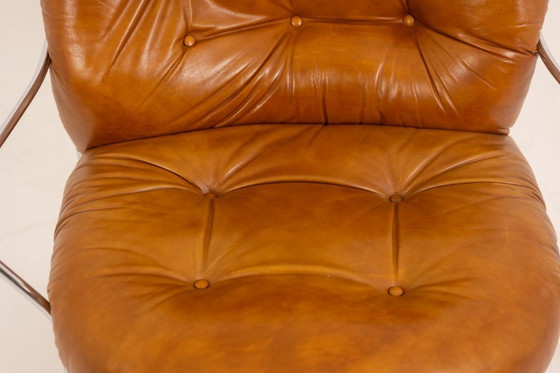 Image 1 of Carlo Di Carli. Lederen en metalen fauteuil. Jaren 70.