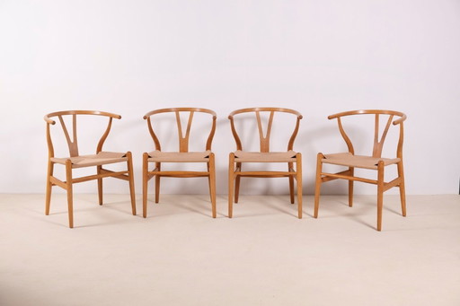 4 sedie Wishbone CH24 in rovere di Hans J. Wegner, anni '80