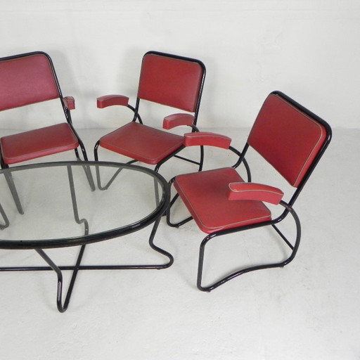 Conjunto de 4 sillones y mesa de centro con estructura tubular de estilo Bauhaus, década de 1950.