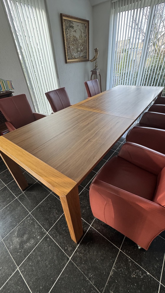 Image 1 of Dining table with 8 leather chairs in my