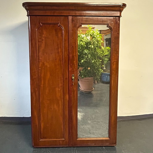 Antique closet with pull-out clothes rail