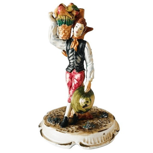 Vintage mid-century Italian Bassano sculpture of a young man with fruit, 1950s, signed