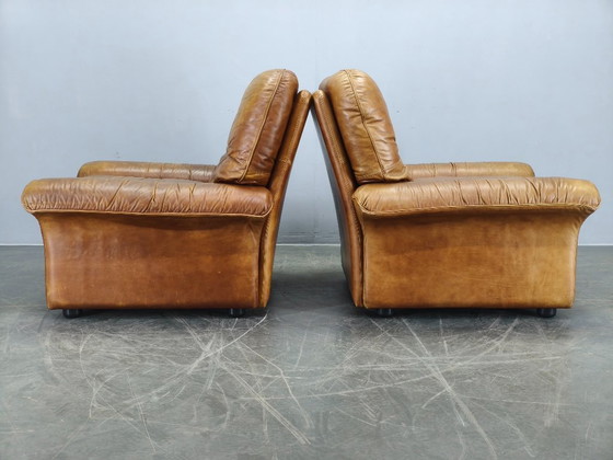 Image 1 of Een paar Arcon Italia loungefauteuils van cognacbruin buffelleer.