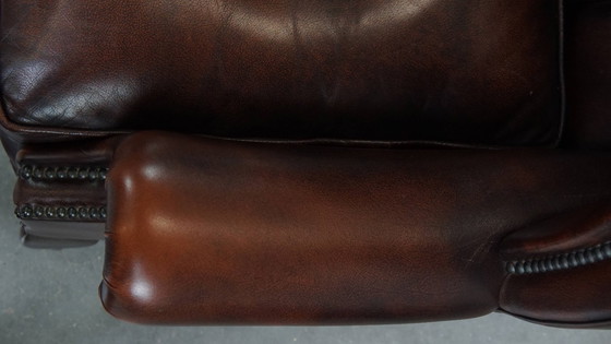 Image 1 of Bruine rundleren chesterfield oorfauteuil