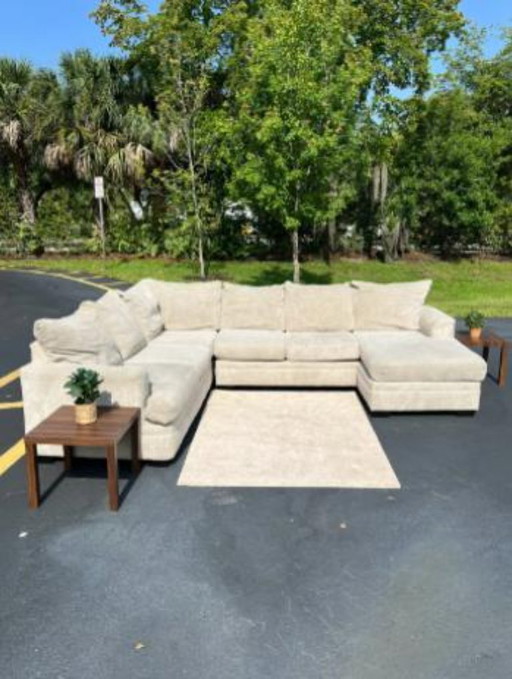 Beige Rooms To Go Sectional Couch & Storage Ottoman