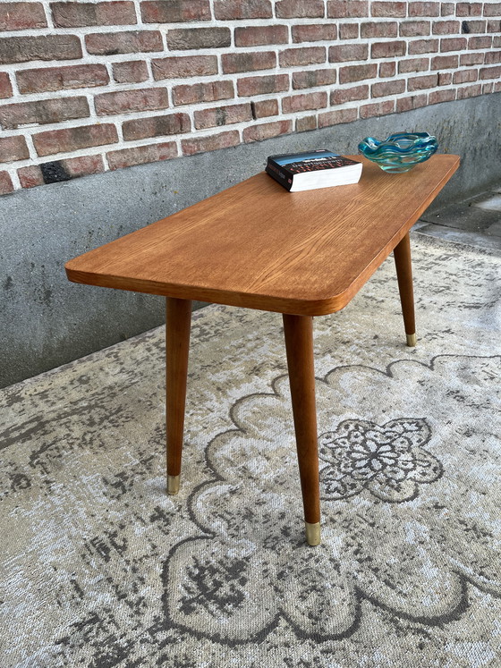 Image 1 of Vintage mid-century Danish coffee table on beautiful tapered legs with brass caps