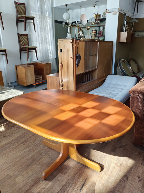 Image 1 of Extendable round to oval dining table