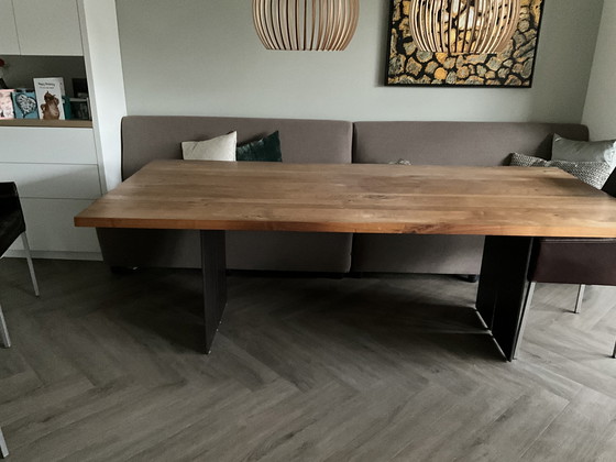 Image 1 of Natura dining table in walnut with black knots