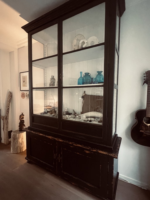 Characterful antique display cabinet with a weathered finish