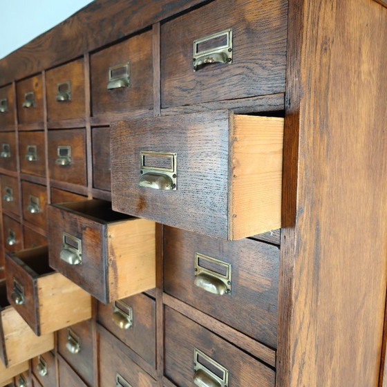 Image 1 of Oak apothecary cabinet from the early 20th century with 42 drawers