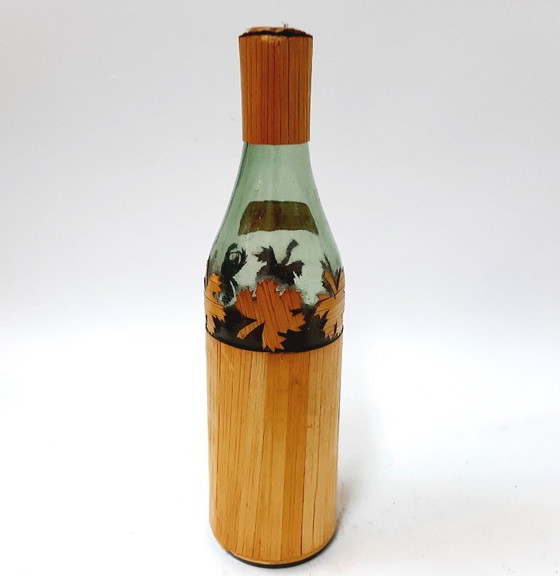 Image 1 of Vintage glazen fles omwikkeld met riet