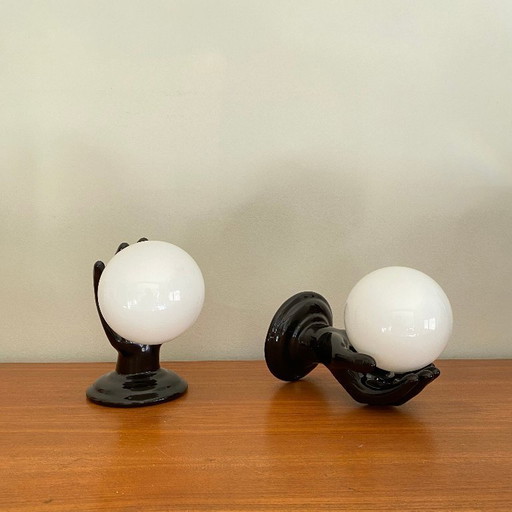 Pair of black ceramic hand-shaped wall sconces from the 70s and 80s