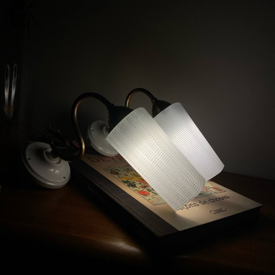 Image 1 of Pair of brass gooseneck wall lights with white glass and porcelain mounting rosettes