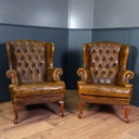 un set di due poltrone Chesterfield vintage color cognac
