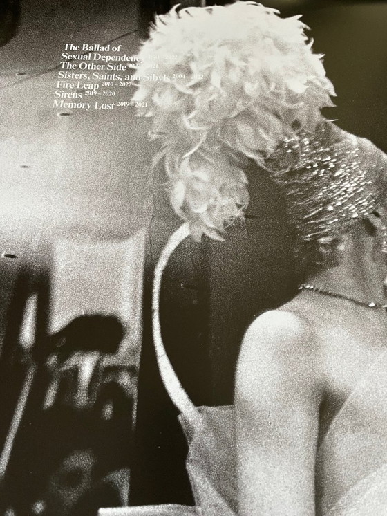 Image 1 of Nan Goldin, exibition poster  “This Will Not End Well” Naomi presenting a stage show, Boston (1973) fran The Other Side, 1992-20