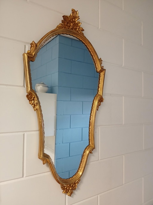Vintage mirror with gold leaf decoration