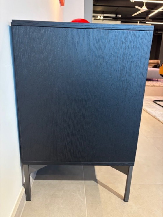 Image 1 of KENDO IS A SIDEBOARD WITH UNUSUAL GEOMETRIC DOORS: EACH ONE HAS A 30° CUT THAT DIVIDES IT INTO TWO PARTS THAT ARE NOT PERFECTLY 