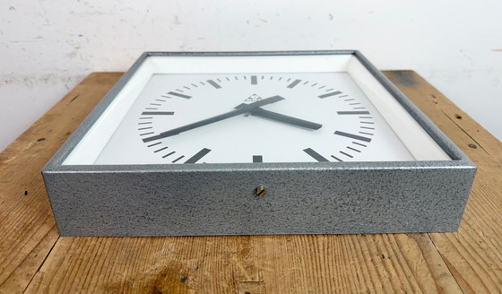 Image 1 of Graue, quadratische Wanduhr im Industriestil von Pragotron, 1970er Jahre
