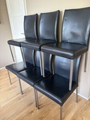 6 zwart leren eetkamerstoelen met rvs poten