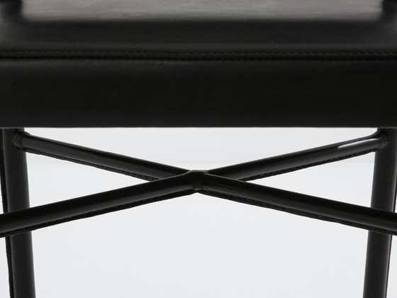 Image 1 of Jacques Quinet paar leren bijzettafels met zadelstiksel en messing details, 1950