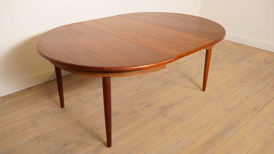 Image 1 of Table de salle à manger ronde vintage | extensible | teck | 130 - 240 cm