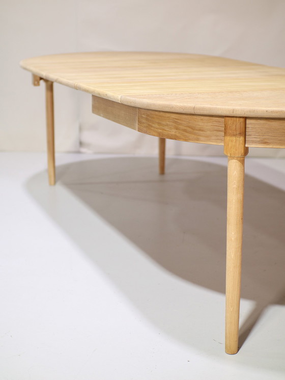 Image 1 of Extendable dining table Henning Kjaernulf oak Danish