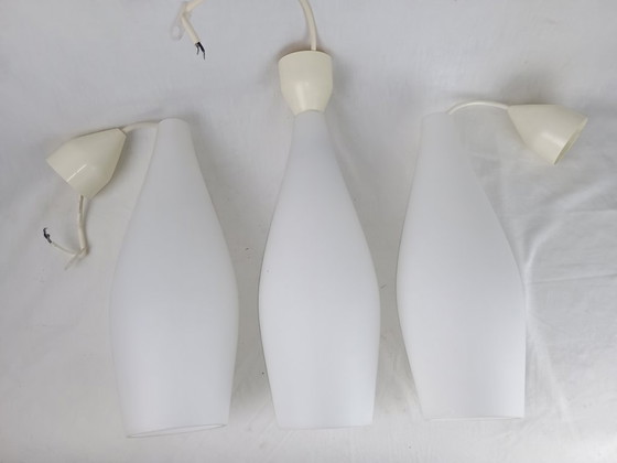 Image 1 of Elegant and timeless, this set of three original Holmegaard glass pendant lamps
