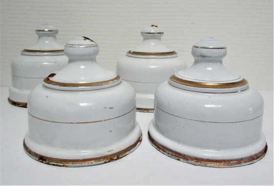 Image 1 of four enameled metal cheese bells, early 20th century