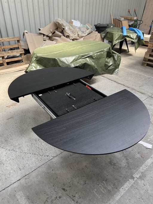Round extendable dining table black oak