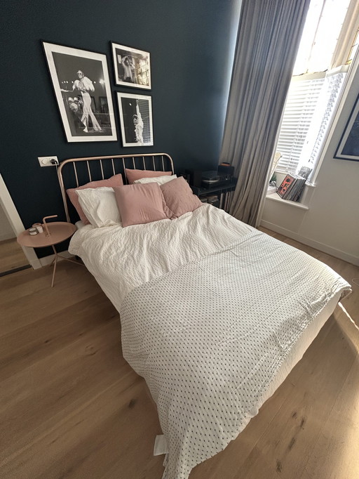 Copper-colored bed brand Made