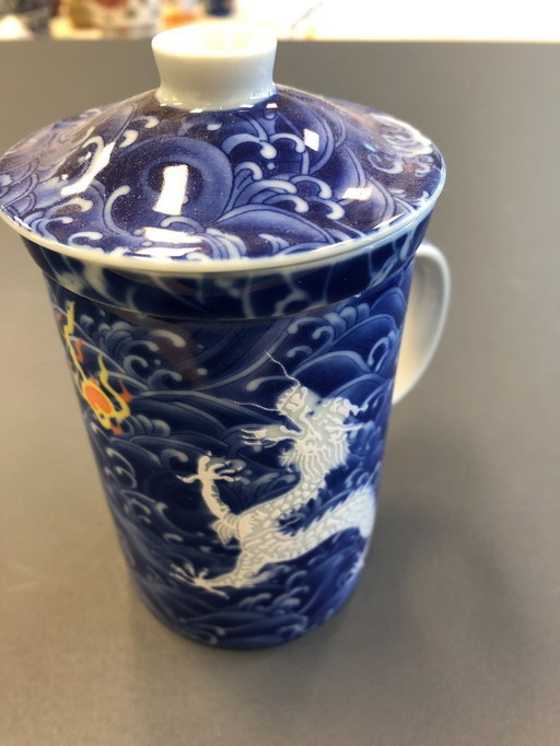 Chinese tea cup with filter and lid