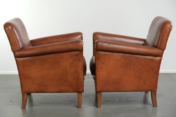 2x Fauteuils en cuir de mouton beaux et confortables avec de belles couleurs et un design intemporel (photo 2 of 14)