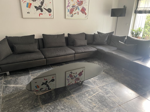 Sofá esquinero Natuzzi con mesa de centro